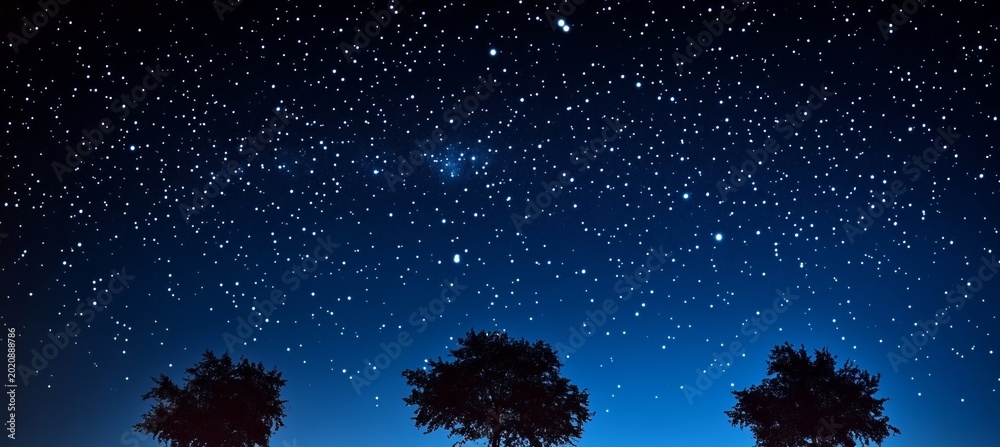 Fototapeta premium Tranquil Blue Starry Sky with Twinkling Constellations and Ethereal Radiance of Dreams