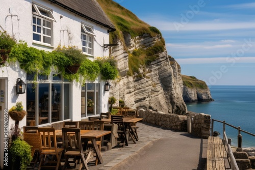 Restaurant patio offering outdoor dining with stunning views of the sea and jurassic coast cliff