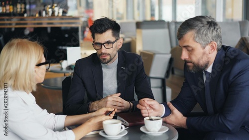 two business people drinking coffee