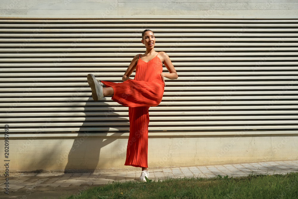Ταπετσαρία Lively female athlete in bright attire executes vigorous kick with vibrant motio