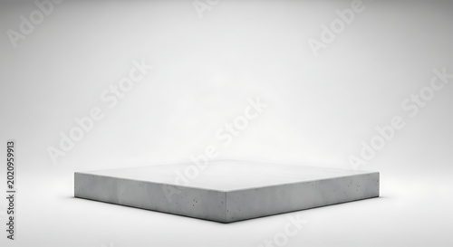 A simple, low-profile concrete platform or stage with a slightly rough texture is centered on a clean white background, product display or