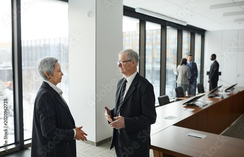 business people shaking hands in office