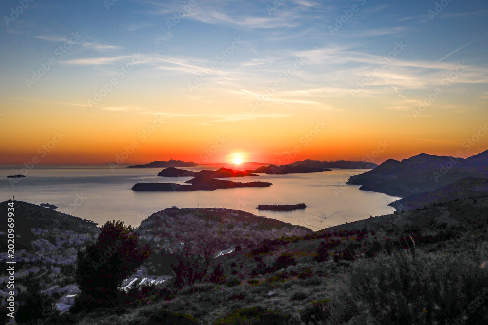 Fototapeta premium Scenic sunset landscape of Adriatic sea coast viewed from Mount Srd near Dubrovnik, Croatia.