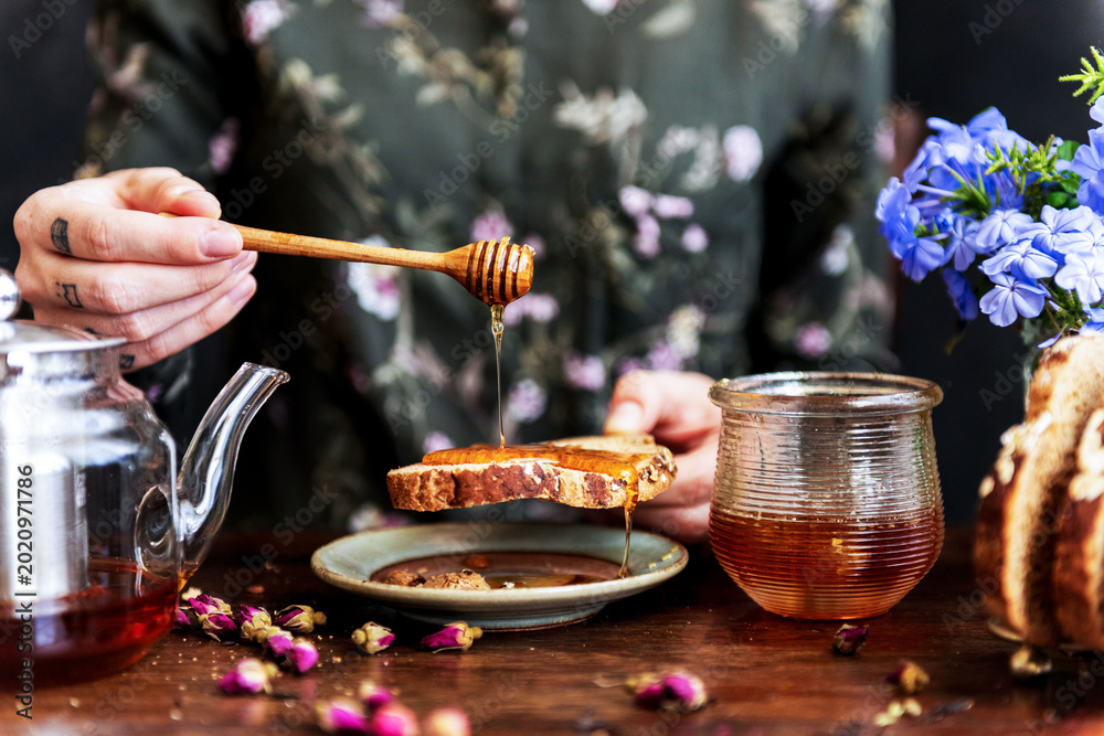 Fotografija Honey drizzling on rustic bread