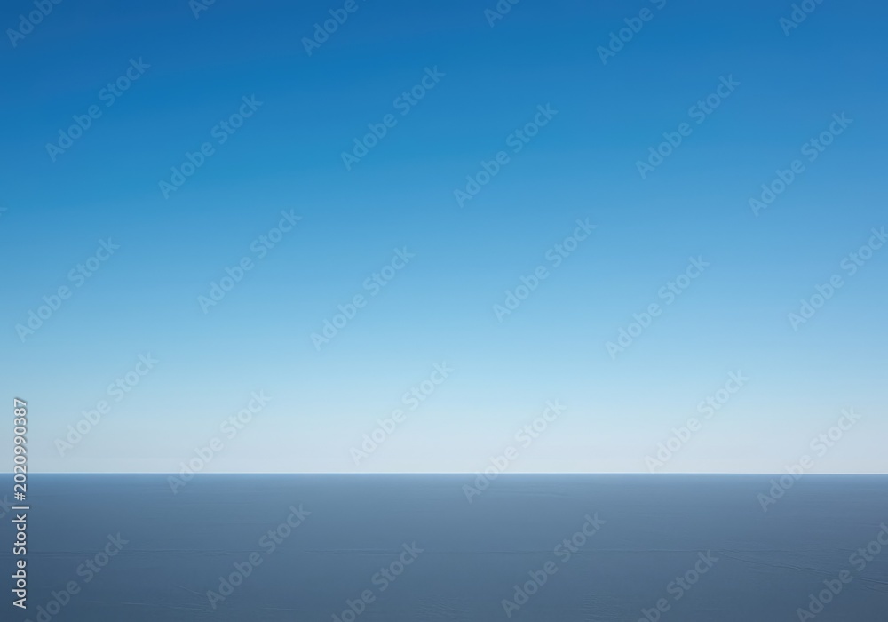 Obraz premium Expansive blue sky backdrop meeting a flat, subtle landscape at the perfect horizontal line. A serene and boundless natural background, sunny, blue, perspective