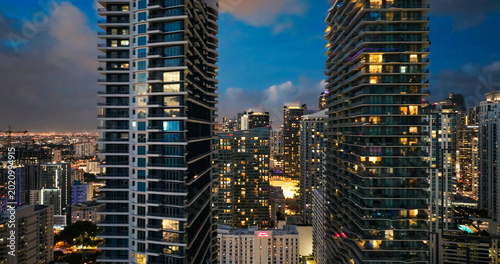 Bild auf Leinwand Miami city skyline vibrant with urban lights at night