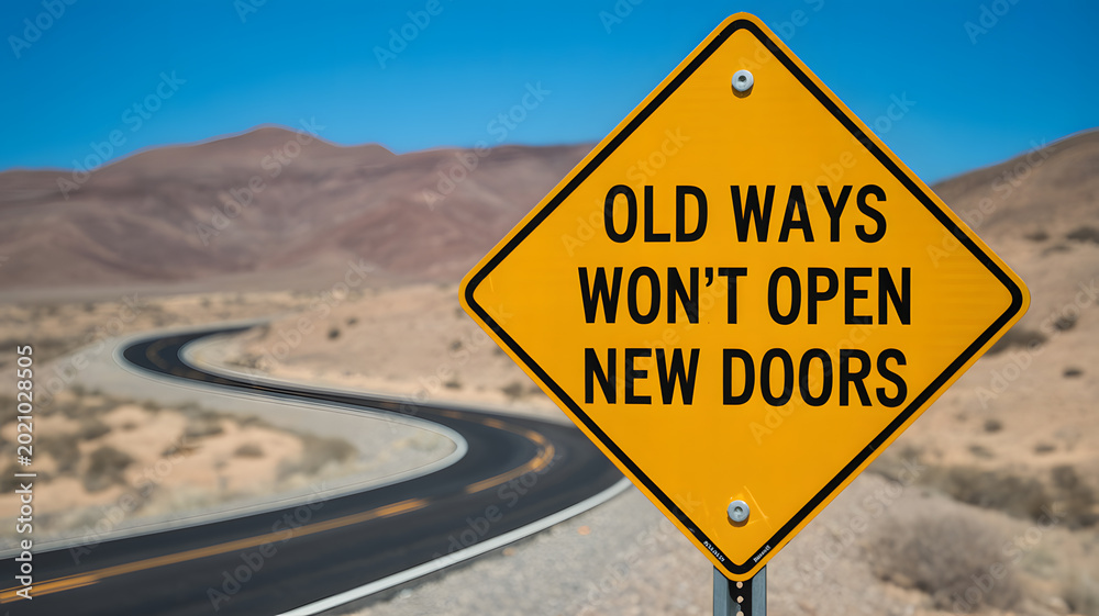 Fototapeta premium A yellow road sign with a motivational quote stands on a desert highway