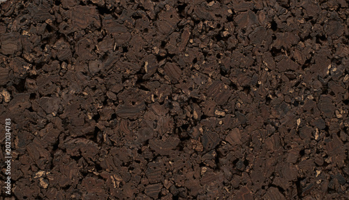 Dark roasted expanded cork bark board texture with porous structure