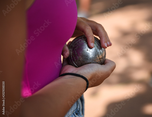 Konstfotografi Girl holding petanque ball