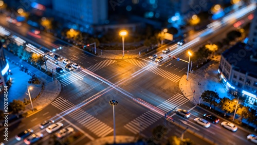 Nighttime city intersection with traffic