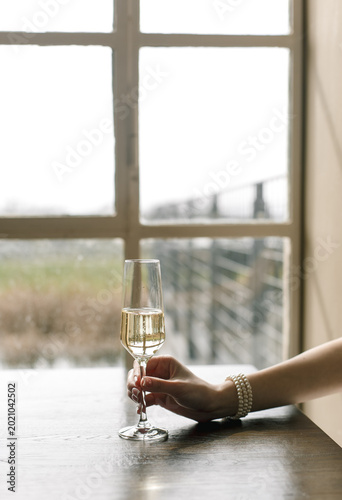 champagne glass window reflection hand jewelry bracelet