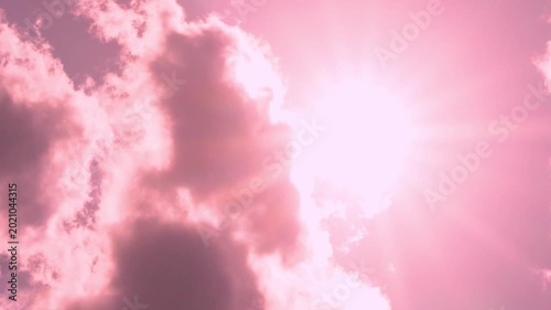 Vertical Footage, Shining Sun Close-Up Pink Blue Sunset Sky Sun and White Pink Fluffy Clouds, Colorful Skyscraper in Sunlight Sun Rays, Aerial View, Air Plane Window View Time Lapse, Slow Motion.