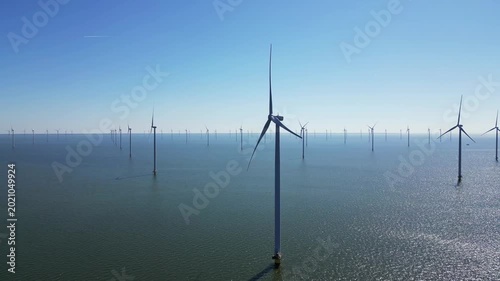 Alternative energy sources, wind turbines produce energy in the north sea, wind farm power plant view from height, green energy.