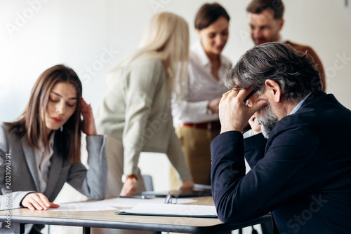 Εκτύπωση καμβά Exhausted business professionals feeling stress during a busy workday in the off