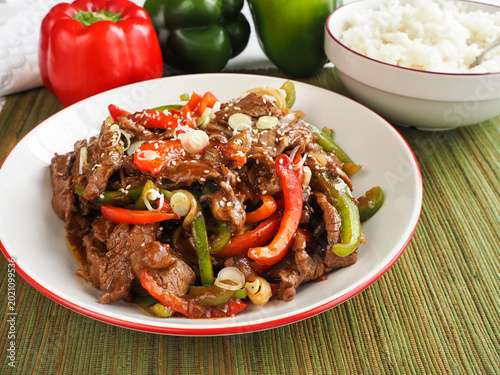Tableau sur toile Stir fry Pepper Steak with Rice and Whole Green and Red BellPeppers and Side Bow