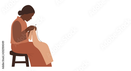 Slika na platnu An African woman sitting on a wooden stool sewing fabric.
