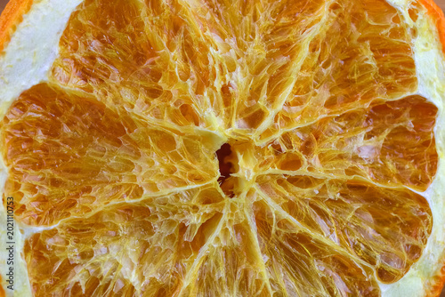Tableau sur toile The surface of a dehydrated slice of orange