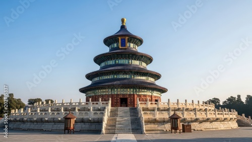 Ornate, multi-tiered circular building with surrounding stone walkway