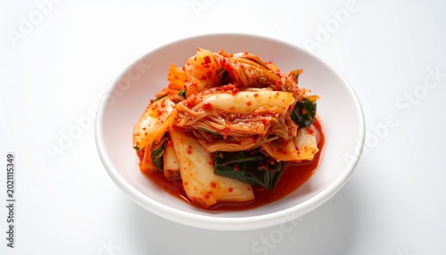 Realistic front-view homemade spicy kimchi in small white bowl, white background, soft lighting, ultra realistic food photo.