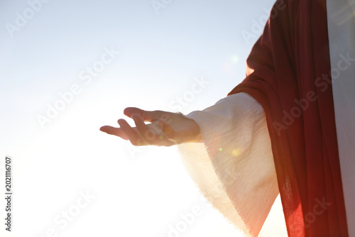 Schilderij op canvas A background of the holy hand of Jesus Christ extending the hand of salvation and guiding souls with the light of love and hope