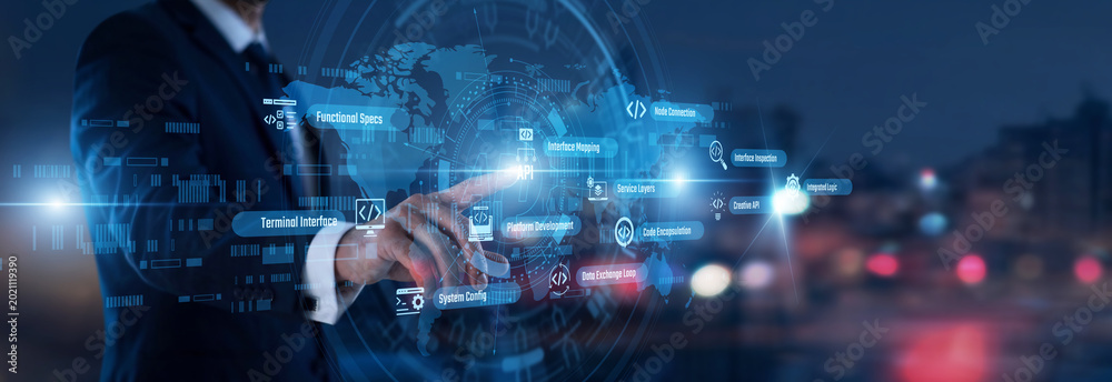 Fototapeta premium Software integration. Developer hand touching API words and icons on a virtual panel. Streamlining application communication and efficient data exchange across multiple platforms.
