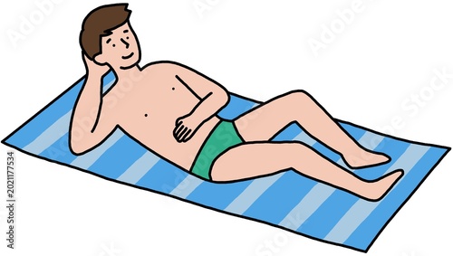 Tableau sur toile A man sunbathing on a striped beach towel