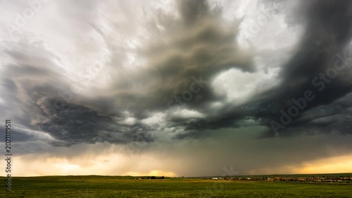 Menacing storm front moving over landscape with dark cloud layers