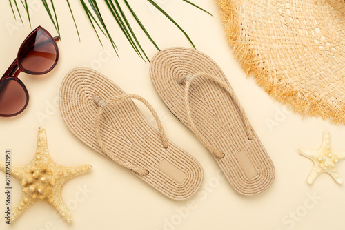 Summer vacation accessories on color background, top view