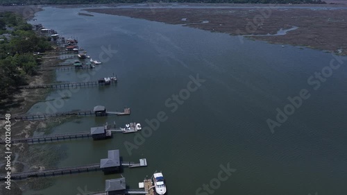 Living in homes and real estate by the Moon River in Savannah, Georgia with docks and natural wetland tidal marsh river