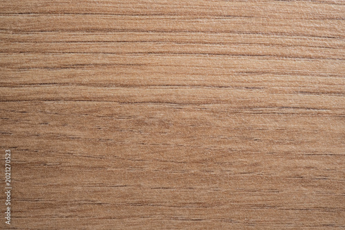 Macro texture of artificial wood grain furniture facade material. Decorative synthetic surface for interior design.