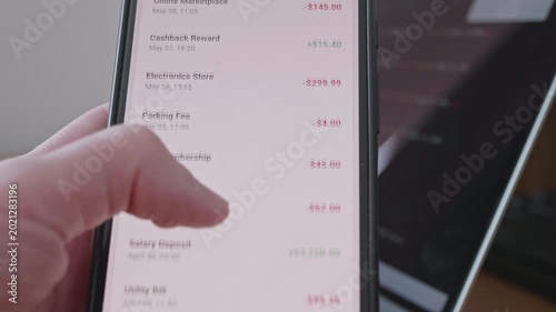 Close up of scrolling through spending and income list in finance application