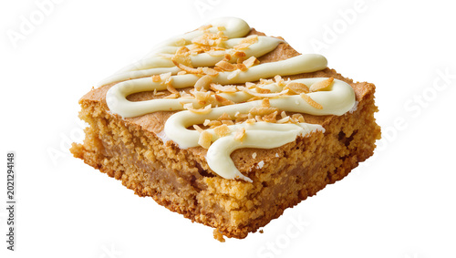 Golden brown blondie with white frosting drizzle and toasted coconut flakes, isolated on transparent background