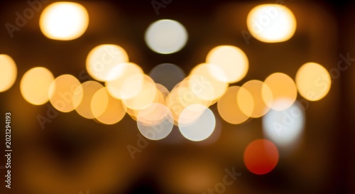 Saudi cultura blurry abstract background with yellow and orange bokeh lights at night