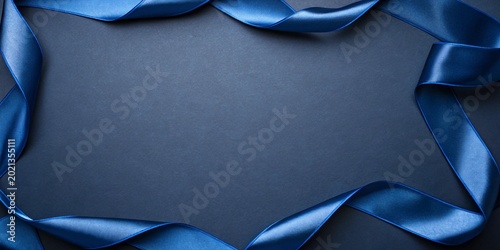 A plain dark blue background with a blue ribbon trim around the edges of the image.
