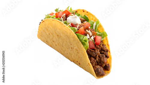 Canvas Print A Mexican taco filled with seasoned ground beef fresh lettuce grated cheese and