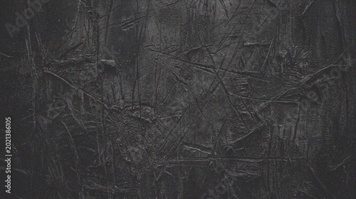 Foto Dark textured background with scratches.