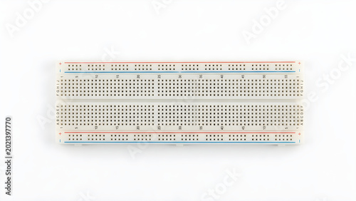 Solderless electronic breadboard isolated on a white background, prototyping board for electrical circuit design and testing