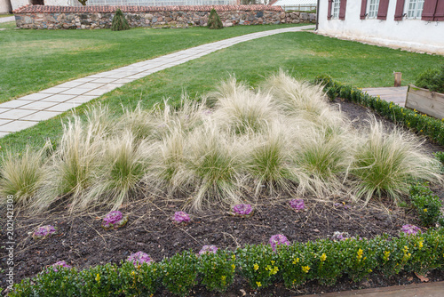 Nurmuiza Manor Garden with Ornamental Grasses and Stone Path