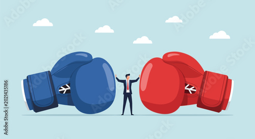 Tableau sur toile Conflict resolution business concept showing man standing between large blue and red boxing gloves representing competition rivalry negotiation and mediation