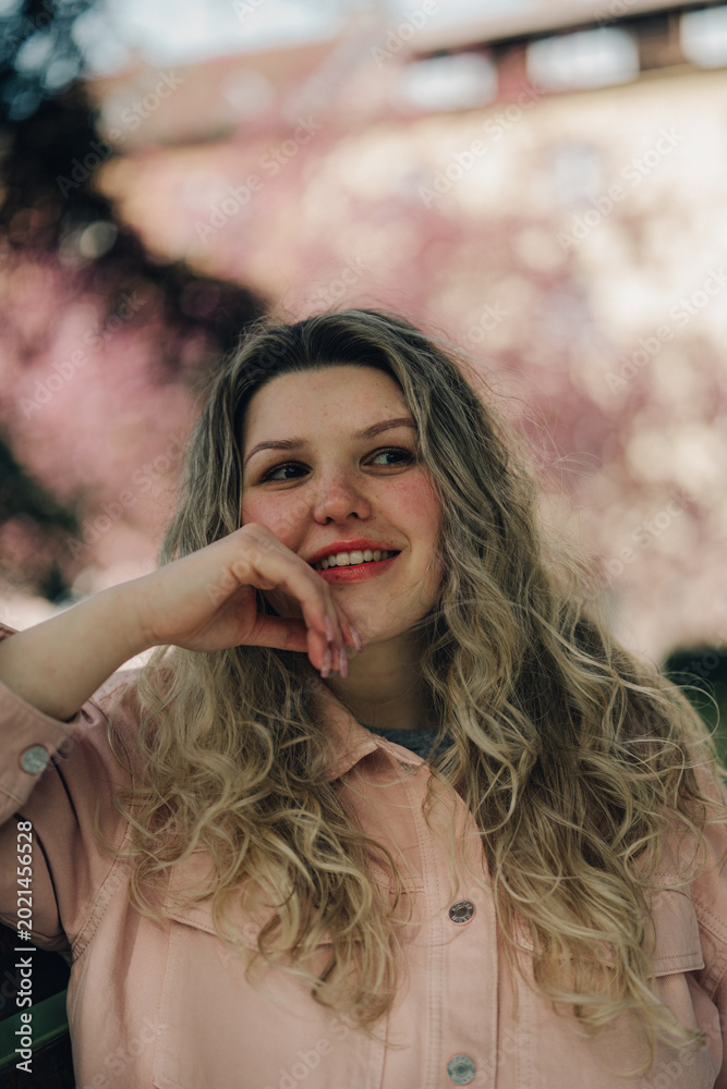 Naklejka premium Young woman portrait outdoors in spring light, natural beauty and soft tones, lifestyle concept in Czech Republic, Europe, commercial use