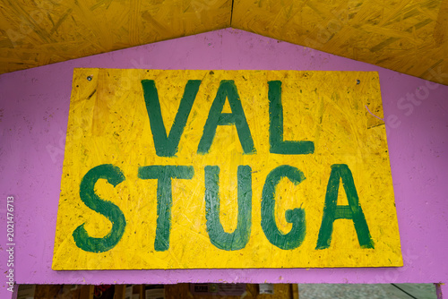 Konstfotografi Stockholm, Sweden  A small sign in a makeshift house says in Swedish, Val Stuga,