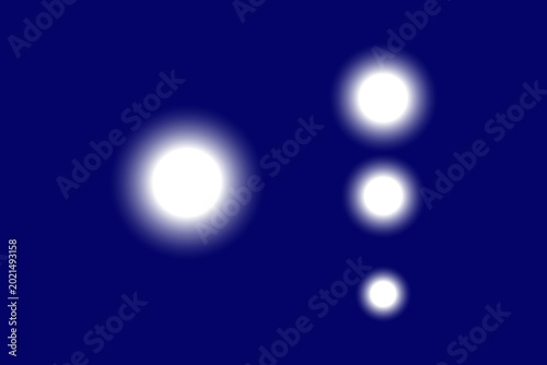 A minimalist abstract graphic featuring four glowing white circular orbs of varying sizes arranged on a deep blue background, symbolizing stars or light spots.