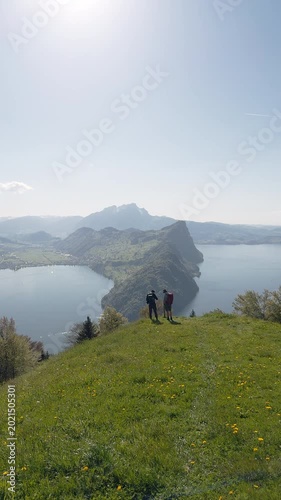 Two Hikers at Scenic Viewpoint Above Lake Lucerne with View of Bürgenstock and Pilatus, Vitznauerstock, Switzerland