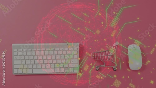 Red orb appearing sending circuit particles over keyboard cart mouse on pink backdrop, mapping data