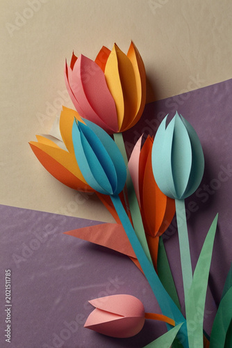 three tulips on wooden background