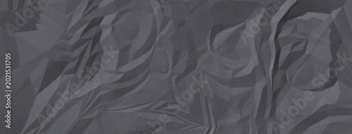 Close-up of rough dark gray stone surface texture