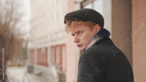 Joyful street creator. Happy city artist expressing creativity amid winter daylight hours. Amicable metropolitan art creator conveying cheerful vibes through casual winter daytime craftsmanship