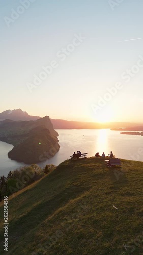 Aerial Drone View of People Watching Sunset Over Lake Lucerne from Märibänkli Viewpoint Above Vitznau, Rigi, Switzerland