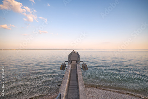 Photos Lighthouse on rocky coast with calm sea