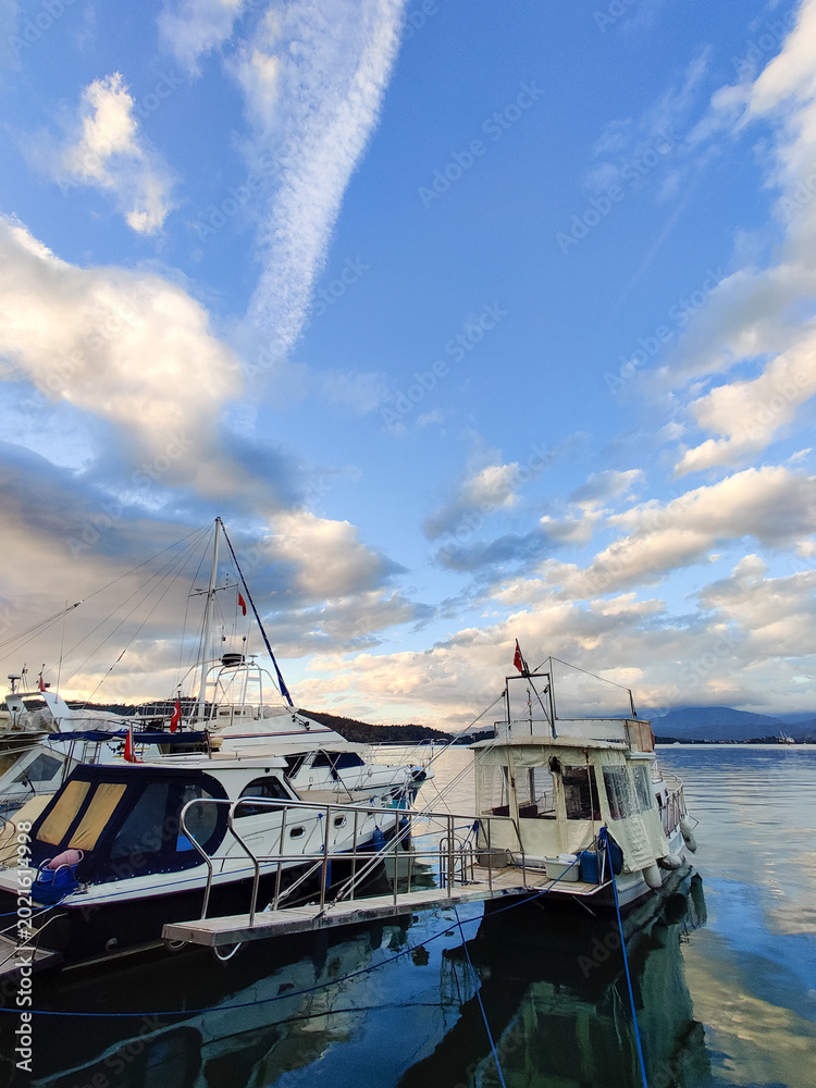 Fototapeta premium beautiful ships and boats are moored near the shore